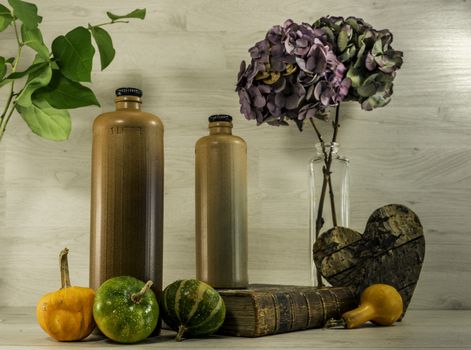 still life  with stone bottles on wooden background