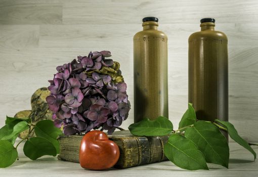 stil life  with stone bottles on wooden background