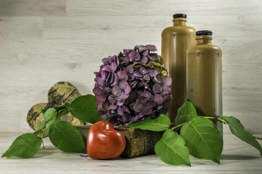 stil life  with stone bottles on wooden background