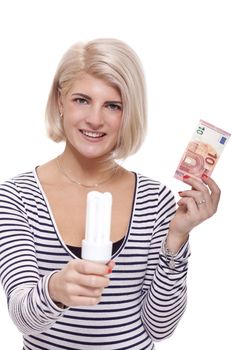 Woman holding an eco-friendly light bulb with a 10 Euro banknote threaded through it in a conceptual image of efficiency and savings