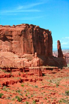 Entrada Sandstone carved for millions of years of weathering result in fantastic shapes in Arches National Park Moab Utah, USA. This monolith is in the Courthouse Towers complex.