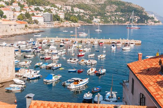 Boats moored in old town pier of Dubrovnik