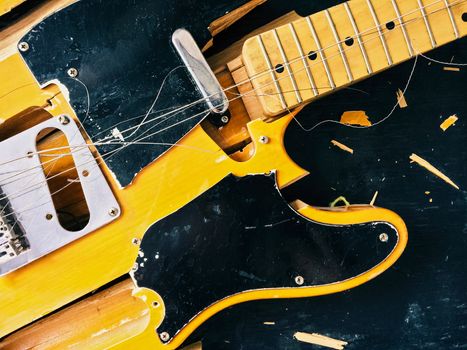 Old broken electric guitar, falling to pieces.