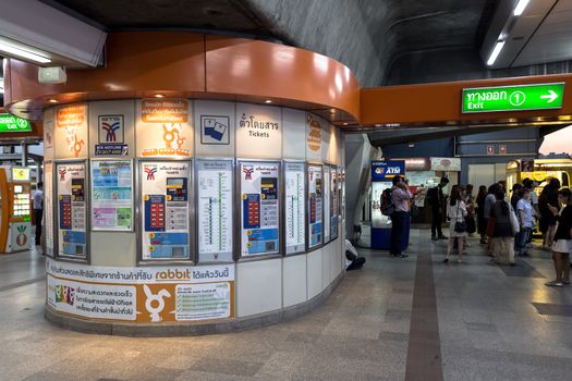 Bangkok, Thailand - January 18, 2016 : Ticket machine in BTS Mo Chit station with nobody buying a ticket and people walking out to the exit. Daily passengers of BTS skytrain is around 700,000