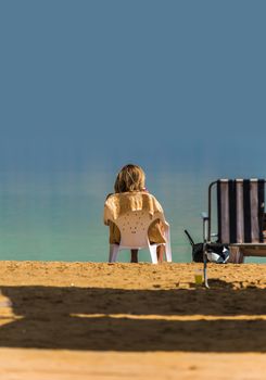 Woman relaxing on the beach Dead Sea