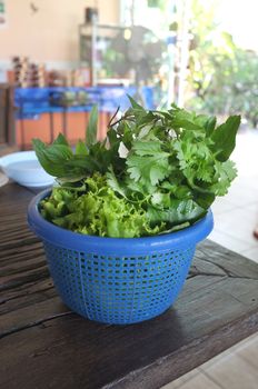 Mixed vegetable and herb in plastic basket