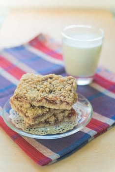 The vertical view of the cookies and milk