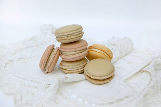 Macaron is a sweet dessert made from polymer mixtures rack sink with egg whites, icing sugar, white sugar, almond powder or almond meal. And food coloring Macaron shape sandwich A splice two pieces of bread Have stuffed the middle