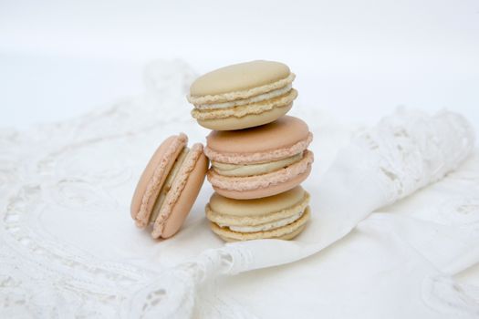 Macaron is a sweet dessert made from polymer mixtures rack sink with egg whites, icing sugar, white sugar, almond powder or almond meal. And food coloring Macaron shape sandwich A splice two pieces of bread Have stuffed the middle