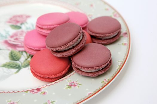 Macaron is a sweet dessert made from polymer mixtures rack sink with egg whites, icing sugar, white sugar, almond powder or almond meal. And food coloring Macaron shape sandwich A splice two pieces of bread Have stuffed the middle