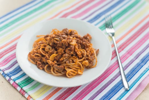 Spaghetti with meat in the white plate
