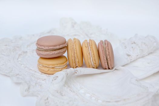 Macaron is a sweet dessert made from polymer mixtures rack sink with egg whites, icing sugar, white sugar, almond powder or almond meal. And food coloring Macaron shape sandwich A splice two pieces of bread Have stuffed the middle