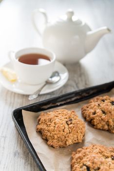 Tea with the oatmeal cookies on the baking dish