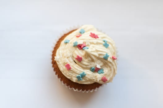 The cupcake with colored decoration