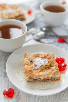 Two pieces of apple pie with tea