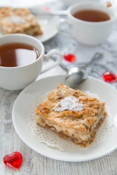 Piece of an apple pie with tea