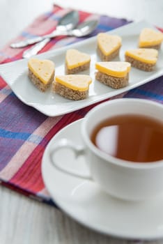 Heart shaped cheese sandwiches with tea