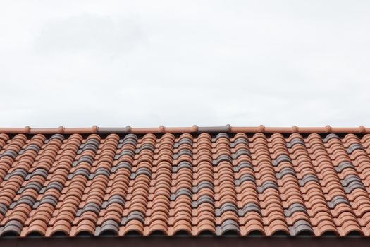 Close up red roof top with sky