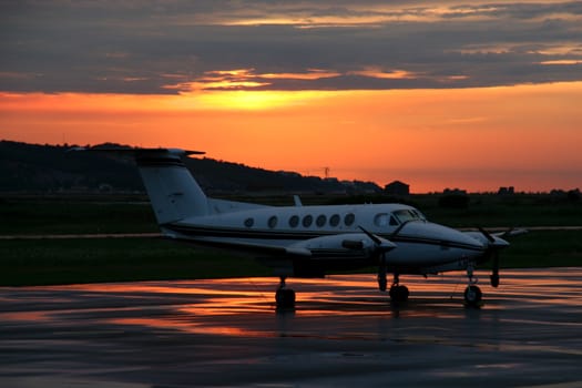 Propeller airplane in the sunset