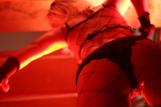 Dancer under the red light