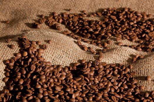 Coffee beans on a sack for background