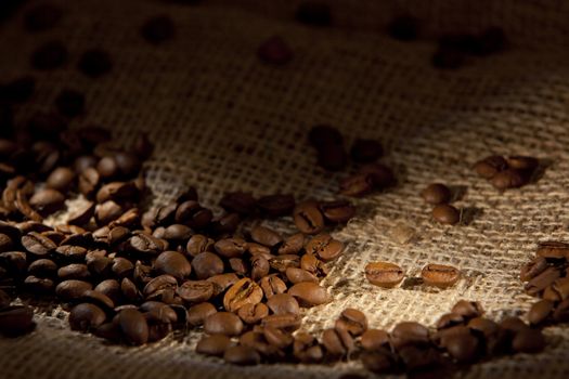 Coffee beans on a sack for background