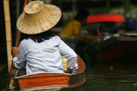 Local people in Thailand living and trading on the river - Damnoen Saduak floating market near Bangkok