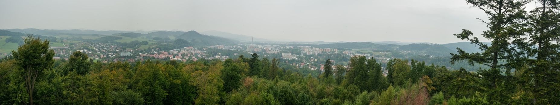 Panorama of beautiful green landscapes in the mist and rain