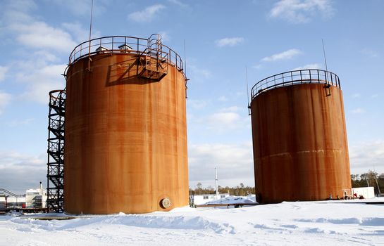 Tank storage crude Oil in winter landscape