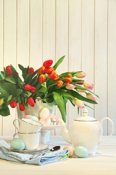 Tulips and colored eggs for Easter