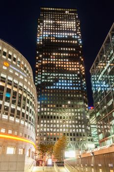 London, United Kingdom - May 9, 2011: Canary Wharf skyscraper and the Thomson Reuters building at night. Canary Wharf is one of London's two main financial centres.