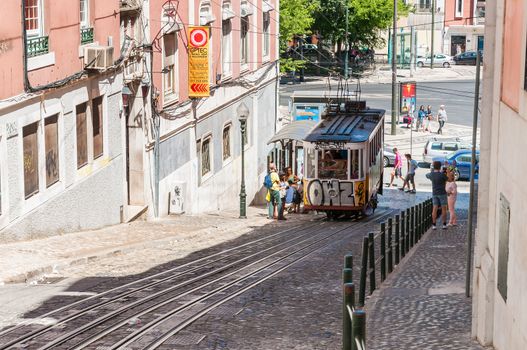 LISBON, PORTUGAL - AUGUST 23: The Gloria Funicular is a funicular that links Baixa with Bairro Alto districts in Lisbon on August 23, 2014. The Glória Funicular was opened to the public on October 24, 1885