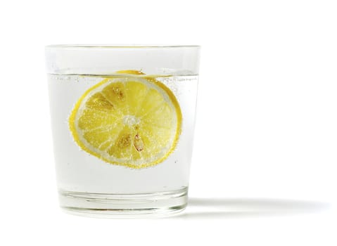 lemon in glass on a white background