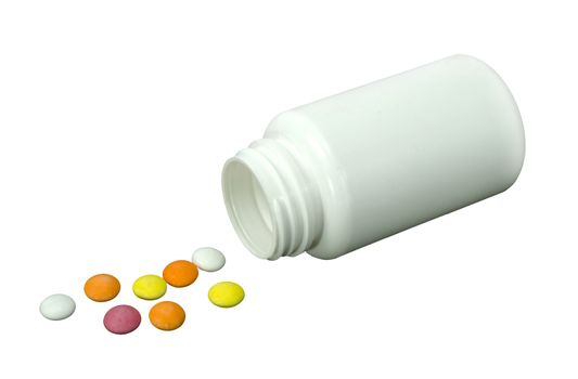 some pills of a different colors with white jar on a white background