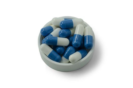 some pills of a white and blue colors with white cap on a white background
