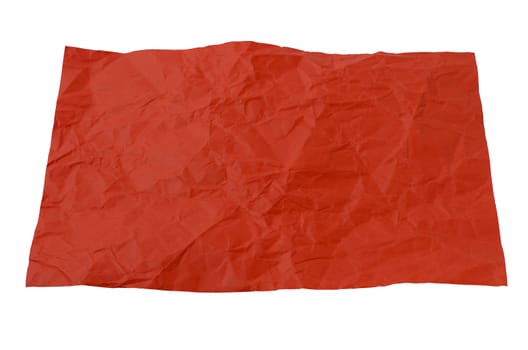 a crumpled piece of red paper on a white background