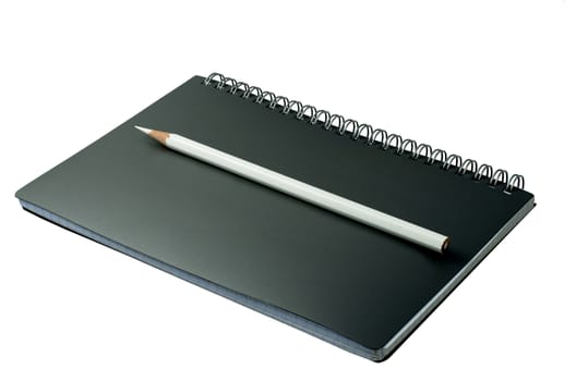 open notebook with pencil on a white background
