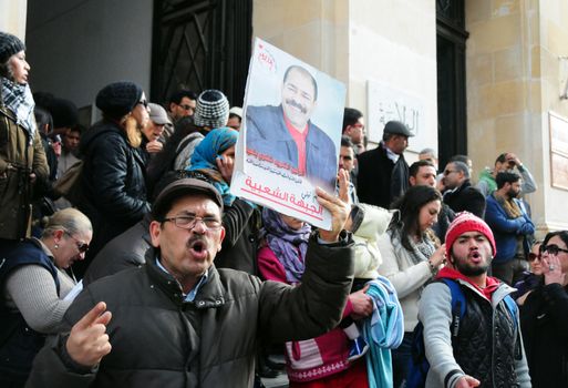 TUNISIA, Tunis: Tunisians shout slogans outside the headquarters of Tunis Governorate, on Habib Bourguiba, during an anti-government demonstration on January 20, 2016  in solidarity with demonstrators demanding jobs in the central Tunisian city of Kasserine Authorities imposed a curfew on the impoverished city of Kasserine, where tensions have been high since January 16, 2016 when a young unemployed man suffered a fatal electric shock during a protest
