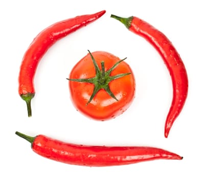 tomatoes and hot peppers on a white background