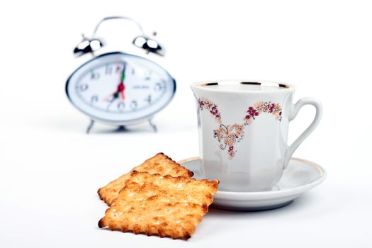 cup of coffee and watch on a white background