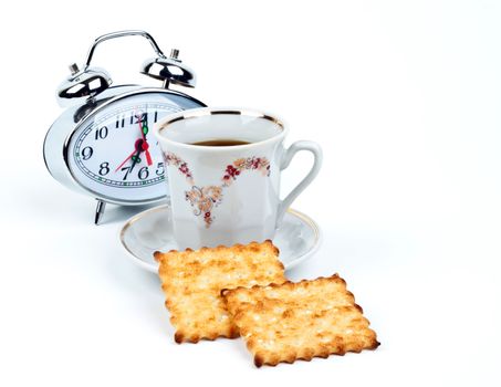 cup of coffee and watch on a white background