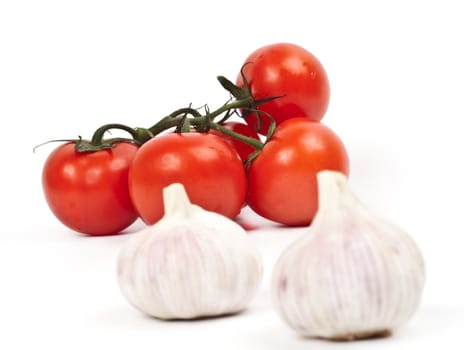 tomatoes and garlic on a light background