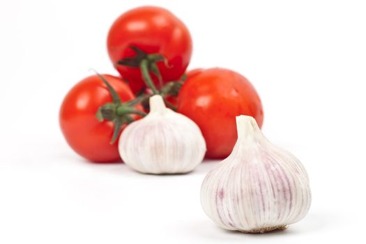 tomatoes and garlic on a light background