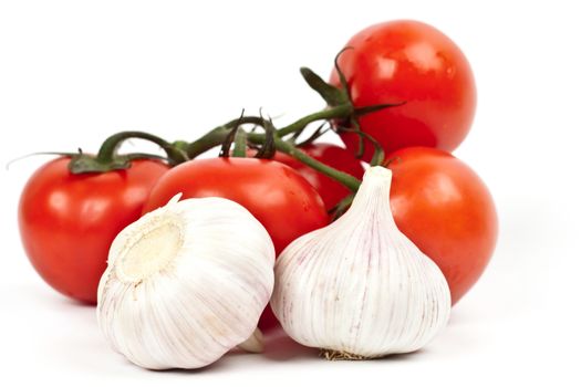 tomatoes and garlic on a light background