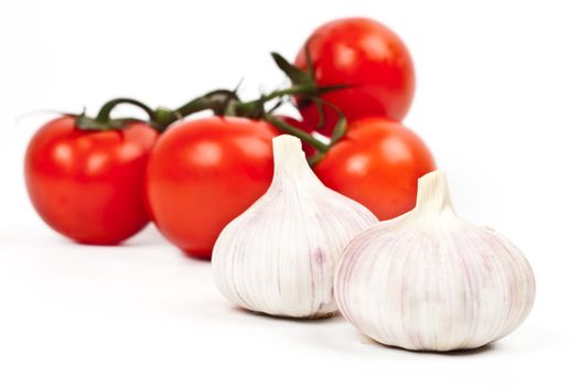 tomatoes and garlic on a light background