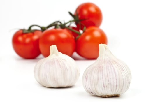 tomatoes and garlic on a light background