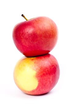 Two red apples on a light background