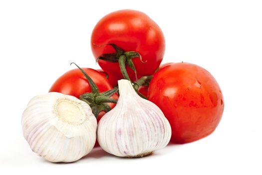 tomatoes and garlic on a light background