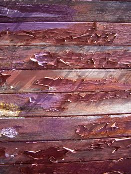 Peeling paint on old wood planks