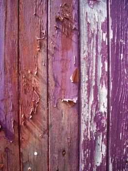 Flaking paint on old wood boards